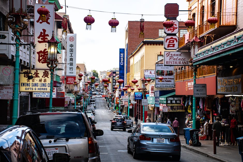 A bustling restaurant with decorative Chinese lanterns and diners enjoying their meals.